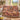 Vendange Vineyard Harvest Luxe woven blanket draped over a sofa in a living room