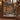 Victorian Christmas Toy Shop woven blanket draped over a carved wooden staircase banister