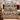 Victorian Christmas village woven blanket draped over a sofa