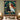 Wicked Oz Friendship Christmas woven blanket displayed as a wall tapestry above a bed with sage green pillows