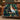 Wicked Oz Friendship Christmas woven blanket draped over a cognac leather sofa