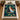 Wicked Oz Friendship Christmas woven blanket spread on a bed between wooden nightstands