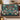 Personalized Wilderkind Christmas Garden woven blanket with custom family name draped over a sofa by a Christmas tree