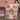 Two girls holding a custom name Winnie the Pooh pink Christmas ornament fleece throw in a pink bedroom