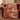 Winter Forager Trail woven blanket draped over a sofa