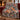 Winter Fox Hellebore woven blanket draped over a sofa