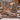 Woodland Christmas Deer Family woven blanket displayed outdoors on a snowy cabin porch rail