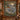 Woodland Christmas Red Deer Crossing woven blanket displayed as a wall tapestry in a log cabin entry