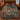 Woodland Lantern Path Christmas woven blanket with custom family name spread on a bed