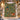 Woodland lantern woven blanket displayed outdoors on a snowy Christmas porch