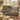 Zinnia Lavoir Village Garden woven blanket draped over a sofa in a sunny living room
